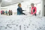 …кто-то делает маскировочные сети, тактические носилки…